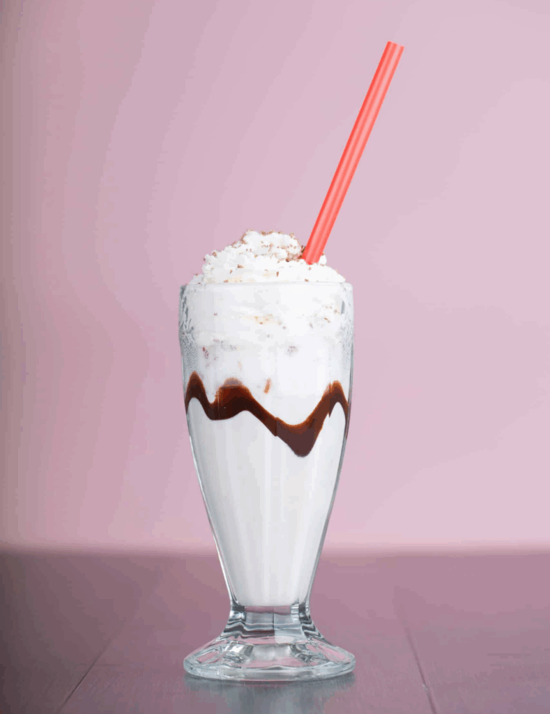 vanilla milkshake on pink background